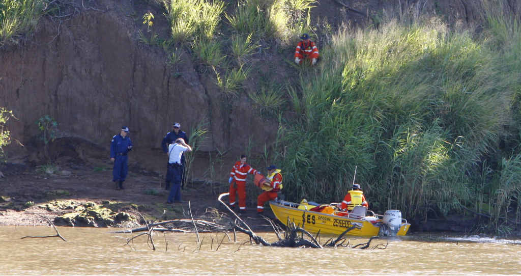 SES volunteers and police search the Brisbane River at Goodna after receiving reports of a murder. SES volunteers and police search the Brisbane River at Goodna after receiving reports of a murder.